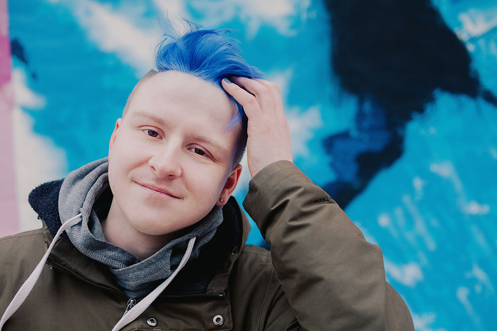 Aleksandr Muravev - man with blue hair.