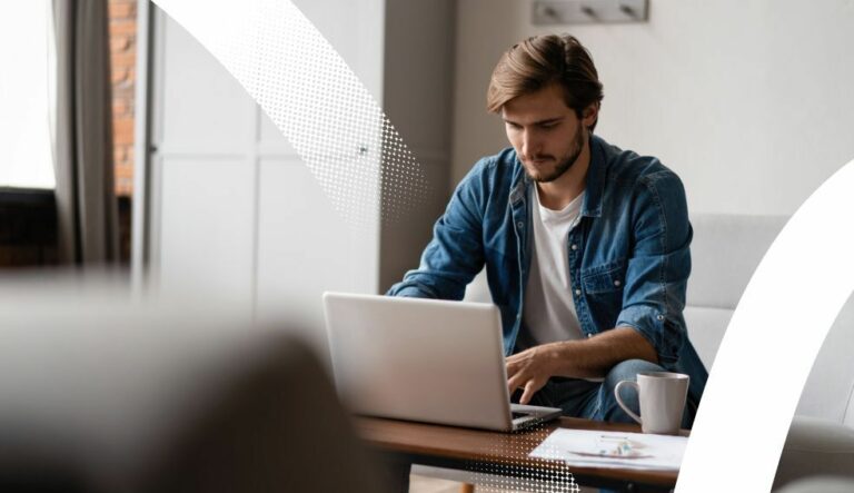 man on sofa with laptop