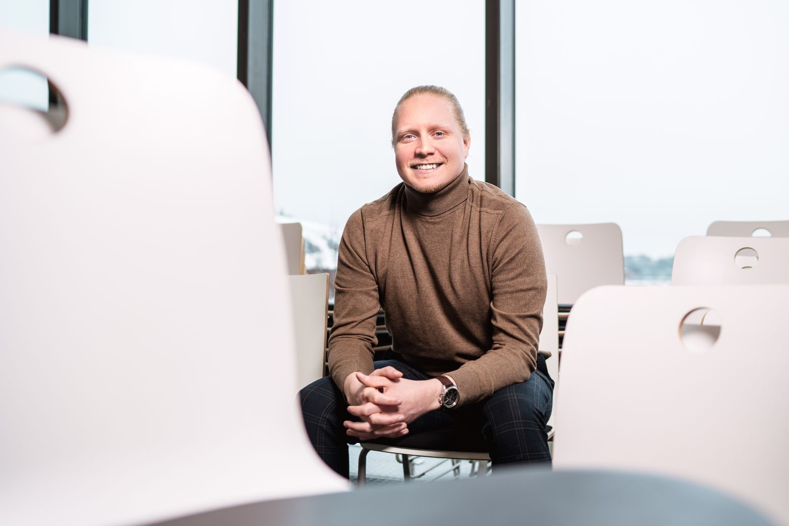 Person sitting and smiling at the camera