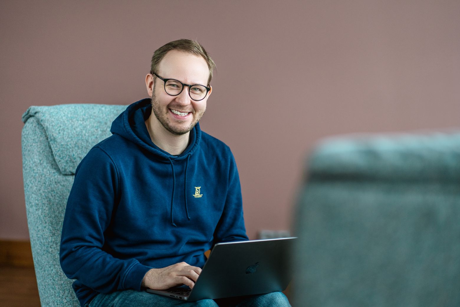 Happy person working on a laptop