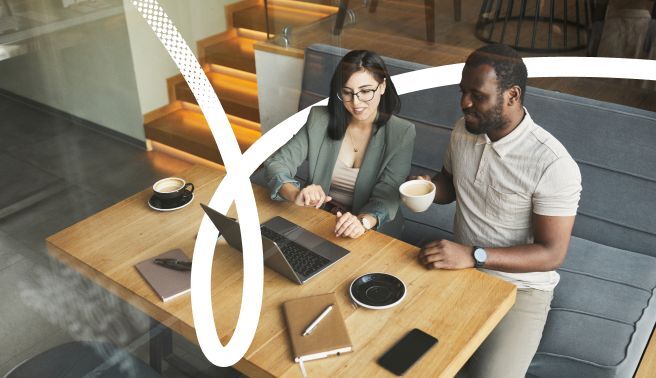 Man and colleague in a meeting with coffee image for Valamis career development plan CDP template guide