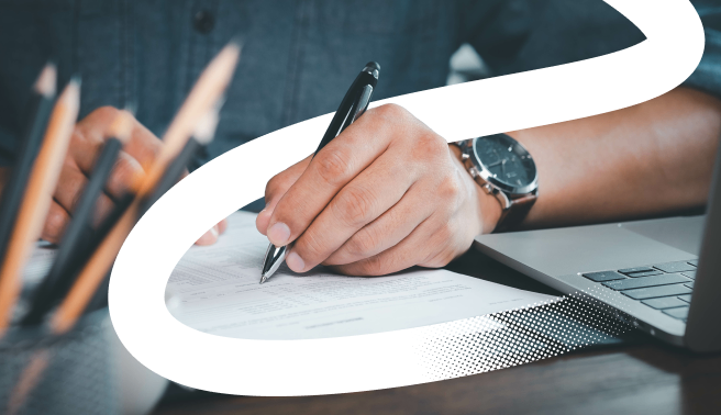 pen writing on a report