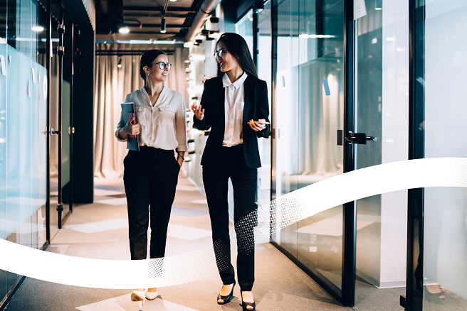 Announcement image for SAP SuccessFactors LMS blog with two women walking in an office
