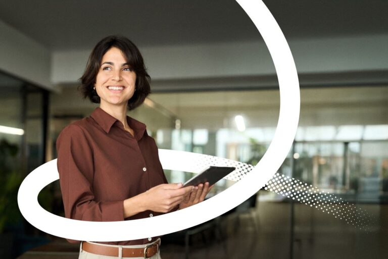 A Valamis branded image of a women holding a tablet. Part of the Fosway AI research assessment 2026 for Valamis